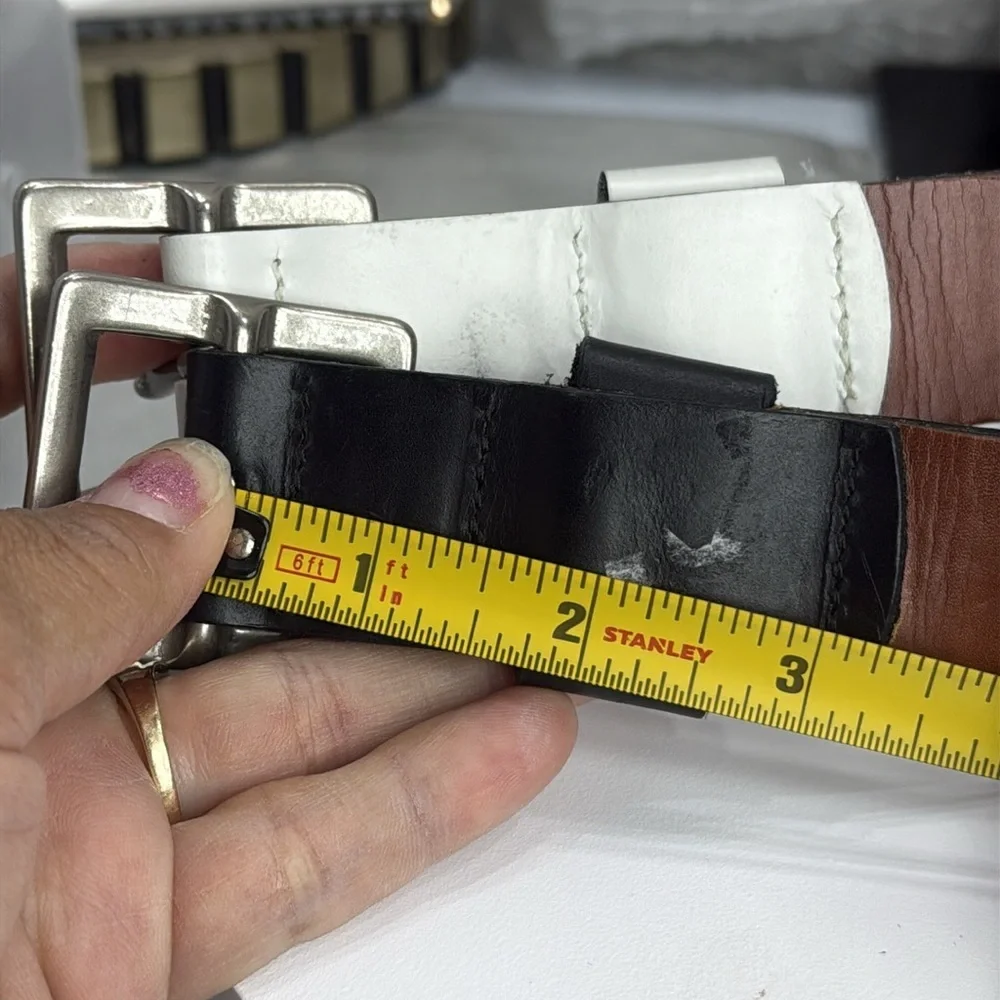 (H)Two Pebble Beach boys' leather belts with black and white metal silve buckles